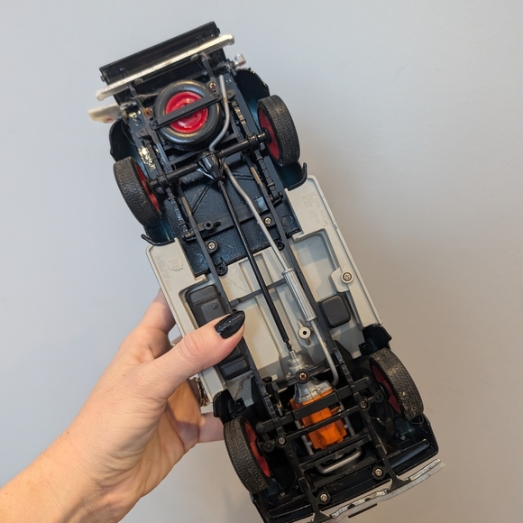 Classic Black Toy Truck with Red Wheels - Picture 10 of 11